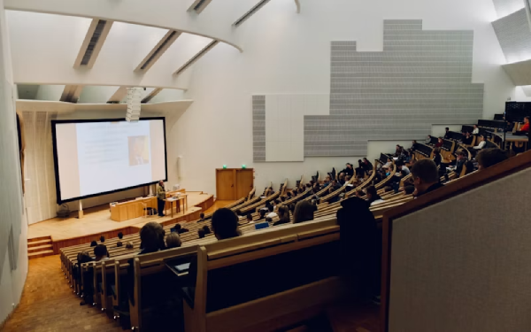 Interior view of a large tiered lecture hall